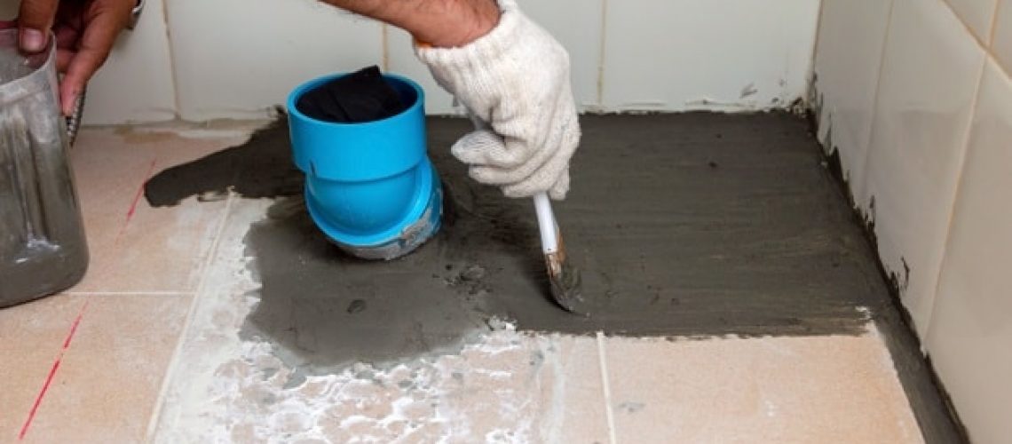construction-workers-are-brushing-waterproofing-cement-tile-floors-bathroom_47469-648